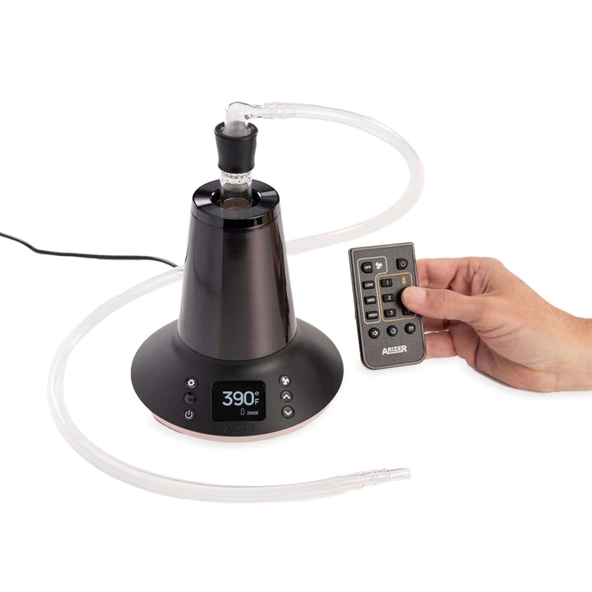 a person holding a remote control next to a lamp