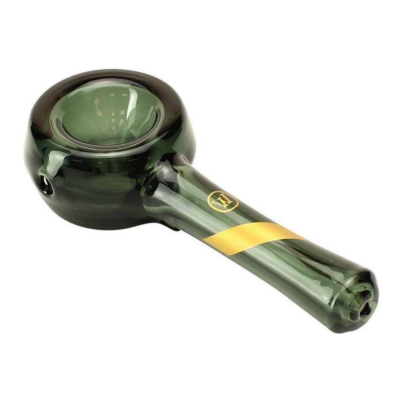 a green glass pipe with a yellow stripe