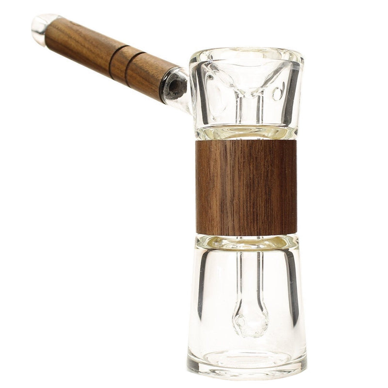 a glass bottle with a wooden stopper