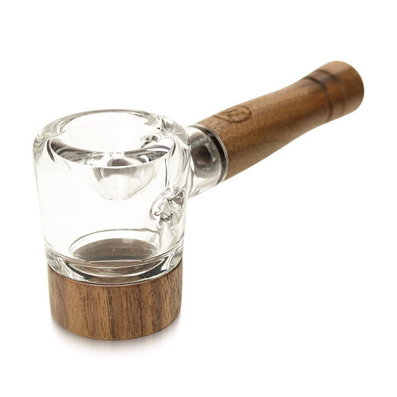 a glass with a wooden handle on a white background
